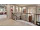 Elegant staircase with decorative iron railings and wood accents overlooking a living area at 8447 W Tether Trl, Peoria, AZ 85383