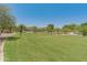 Community volleyball court surrounded by green space and desert landscaping at 8447 W Tether Trl, Peoria, AZ 85383