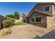 Backyard featuring low maintenance desert landscaping and artificial lawn at 8758 W Hayward Ave, Glendale, AZ 85305