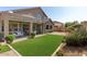 A landscaped backyard and covered patio perfect for outdoor entertaining at 8758 W Hayward Ave, Glendale, AZ 85305