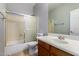 Bathroom with vanity sink, tile floors, and glass enclosed shower at 8758 W Hayward Ave, Glendale, AZ 85305