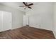 A room with wood floors and a ceiling fan at 8758 W Hayward Ave, Glendale, AZ 85305