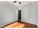 A well-lit bedroom with hardwood floors and ceiling fan at 8758 W Hayward Ave, Glendale, AZ 85305