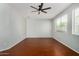 Large bedroom features a ceiling fan and two windows providing ample natural light at 8758 W Hayward Ave, Glendale, AZ 85305