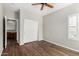 A room with wood floors, closet, and a window at 8758 W Hayward Ave, Glendale, AZ 85305