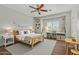 A charming bedroom with wood floors and window shutters at 8758 W Hayward Ave, Glendale, AZ 85305