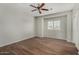 Spacious bedroom featuring modern wood flooring and a ceiling fan at 8758 W Hayward Ave, Glendale, AZ 85305