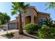 Beautiful two-story home with a three-car garage, desert landscaping, and a towering palm tree in the front yard at 8758 W Hayward Ave, Glendale, AZ 85305