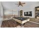 Spacious game room with a pool table, ceiling fan, and built-in shelving, perfect for entertaining guests at 8758 W Hayward Ave, Glendale, AZ 85305