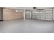 Spacious garage with storage cabinets and two garage doors at 8758 W Hayward Ave, Glendale, AZ 85305