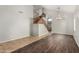 Open living room with high ceilings, staircase, and a mix of tile and hardwood floors at 8758 W Hayward Ave, Glendale, AZ 85305