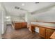 Open upstairs area with hardwood floors and built-in desk and cabinets at 8758 W Hayward Ave, Glendale, AZ 85305