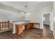 Upstairs office space with a built-in desk and wood floors at 8758 W Hayward Ave, Glendale, AZ 85305
