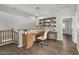 Upstairs office space with a built-in desk and shelves at 8758 W Hayward Ave, Glendale, AZ 85305