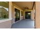 Covered patio with ceiling fan and sliding glass doors for indoor/outdoor living at 8758 W Hayward Ave, Glendale, AZ 85305