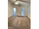 Neutral bedroom featuring a ceiling fan and doors to adjoining rooms at 8840 E Sunland Ave # 142, Mesa, AZ 85208