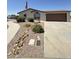 Charming single-story home with well-maintained landscaping and a two-car garage at 8840 E Sunland Ave # 142, Mesa, AZ 85208