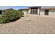 Exterior view of a home with well-maintained landscaping featuring gravel and mature shrubs at 8840 E Sunland Ave # 142, Mesa, AZ 85208