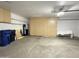 Spacious garage with storage cabinets along back wall at 8840 E Sunland Ave # 142, Mesa, AZ 85208