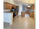 Spacious kitchen with tile floors, ample counter space, stainless steel appliances and wood cabinetry at 8840 E Sunland Ave # 142, Mesa, AZ 85208