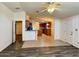 Open floor plan with barstool seating and kitchen access at 8840 E Sunland Ave # 142, Mesa, AZ 85208