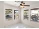 Bright bedroom with white tile flooring and natural light from large windows at 8884 E Arizona Park Pl, Scottsdale, AZ 85260