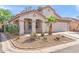 Charming single-story home featuring desert landscaping, a red tile roof, and a covered porch at 8884 E Arizona Park Pl, Scottsdale, AZ 85260