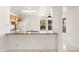 Functional kitchen featuring white appliances, oak cabinets, and granite countertops at 8884 E Arizona Park Pl, Scottsdale, AZ 85260