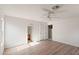 The main bedroom features laminate floors, white walls, ceiling fan, and access to the bathroom at 8884 E Arizona Park Pl, Scottsdale, AZ 85260