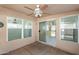 Covered patio area with neutral colors, concrete flooring, and access to home through sliding glass doors at 8884 E Arizona Park Pl, Scottsdale, AZ 85260