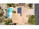 Aerial view showcasing a private pool, solar panels, and well-maintained landscaping at 10794 S Coolwater Dr, Goodyear, AZ 85338