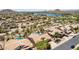 Community aerial view highlighting homes with private pools, desert landscaping, and scenic views at 10794 S Coolwater Dr, Goodyear, AZ 85338