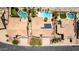 Aerial view showcases pools, landscaping, solar panels and well-maintained homes at 10794 S Coolwater Dr, Goodyear, AZ 85338