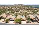 Community aerial view showcasing pools, desert landscaping, and well-maintained homes at 10794 S Coolwater Dr, Goodyear, AZ 85338