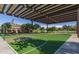 Outdoor basketball court offers covered space to shoot hoops and enjoy the weather at 10794 S Coolwater Dr, Goodyear, AZ 85338