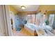 Bright bathroom features a stand up shower with tub, and a large window bringing in natural light at 10794 S Coolwater Dr, Goodyear, AZ 85338