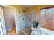 Bathroom featuring a stand up shower with tub and bench, and a large window bringing in light at 10794 S Coolwater Dr, Goodyear, AZ 85338