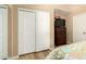 Cozy bedroom offers ample closet space and neutral decor at 10794 S Coolwater Dr, Goodyear, AZ 85338