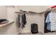 Walk in closet featuring shelf storage and ample hanging space for clothing, luggage, and accessories at 10794 S Coolwater Dr, Goodyear, AZ 85338