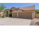 Lovely home boasting a two-car garage, desert landscaping, and a well-manicured yard at 10794 S Coolwater Dr, Goodyear, AZ 85338