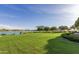 Expansive lawn space offers room to play, relax and enjoy the serene water views at 10794 S Coolwater Dr, Goodyear, AZ 85338