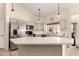 Stylish kitchen with a center island, stainless steel appliances, and ample counter space for meal preparation at 10794 S Coolwater Dr, Goodyear, AZ 85338