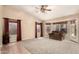 Bright living room with carpeting, a large bay window, and ample natural light for a welcoming ambiance at 10794 S Coolwater Dr, Goodyear, AZ 85338