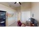 Office space with a dark wood desk, red rolling chair, and a USA map hanging on the wall at 10794 S Coolwater Dr, Goodyear, AZ 85338