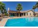 Beautiful backyard with pool and solar panels, perfect for outdoor entertaining at 10794 S Coolwater Dr, Goodyear, AZ 85338