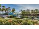 Community waterpark offers playground and water slide features, lush lawns and landscaping at 10794 S Coolwater Dr, Goodyear, AZ 85338