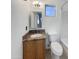 Bright bathroom with a vanity sink, a medicine cabinet, and tile accents at 1105 W Anderson Dr, Phoenix, AZ 85023