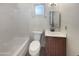 Bathroom with shower and tub combination with natural light and an updated vanity at 1105 W Anderson Dr, Phoenix, AZ 85023
