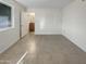 Bright bedroom featuring tile floors, natural light, and a view of the outdoors at 1105 W Anderson Dr, Phoenix, AZ 85023