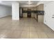 Spacious kitchen open to the living area, featuring tile floors and modern appliances at 1105 W Anderson Dr, Phoenix, AZ 85023